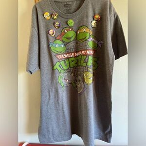 Teenage Mutant Ninja Turtles Tee with 7 1” Button Pins.